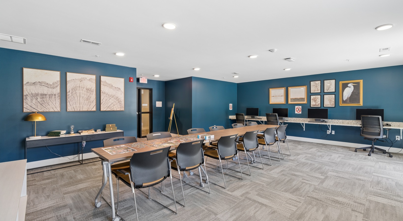 Conference room with long table and blue walls